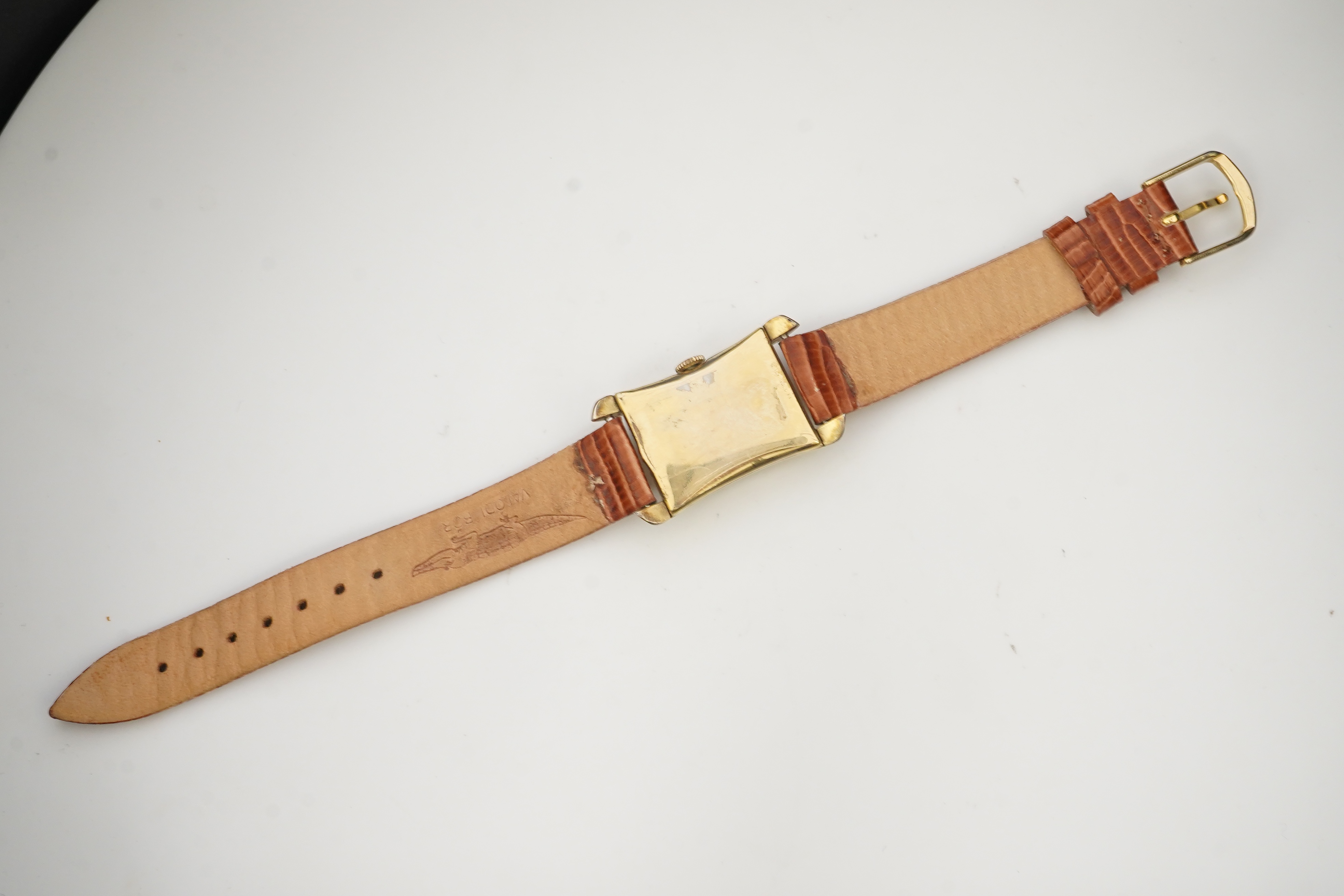 A gentleman's 1950's 10k gold filled Longines manual wind wrist watch, on a later associated leather strap